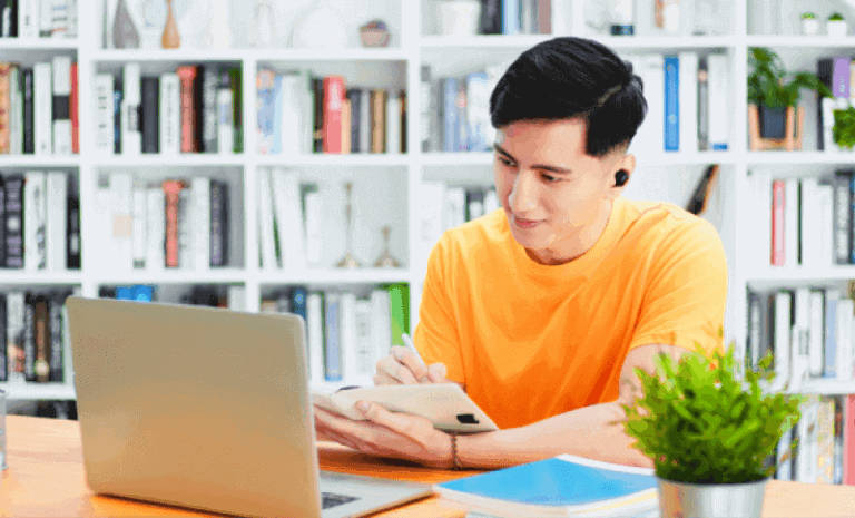 student attending class through laptop