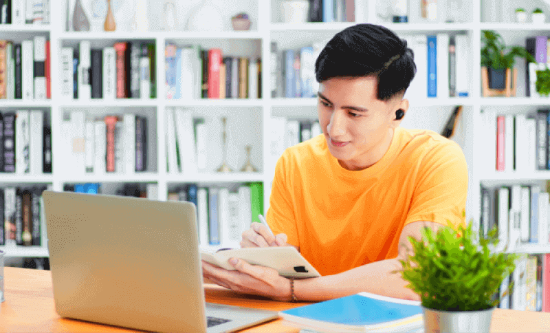 student attending class through laptop