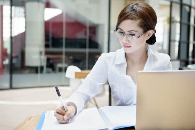 woman writing dissertation