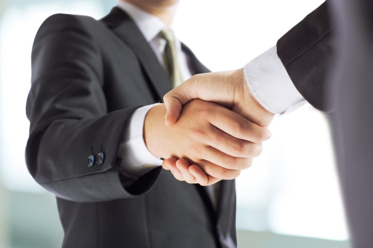 two businessmen shaking hands
