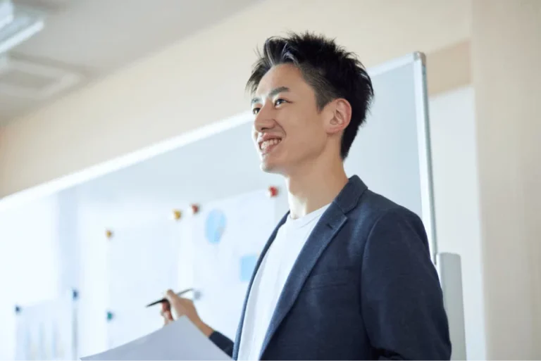 young man presenting at a meeting