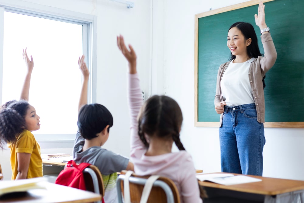 female teacher teaching students