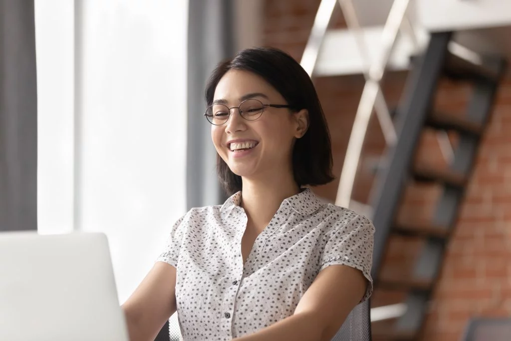 a female IT student using her laptop