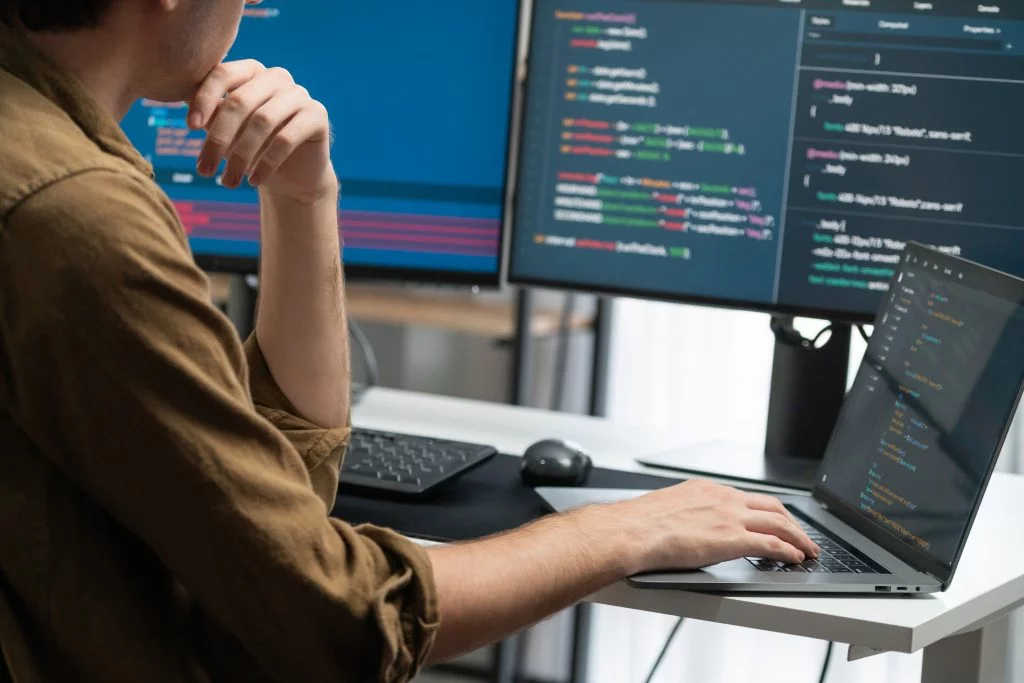 a woman studying cybersecurity