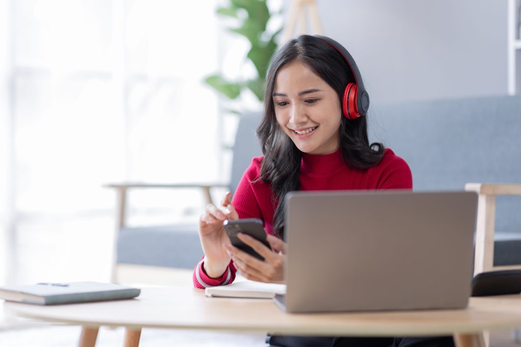 a post graduate student using her phone
