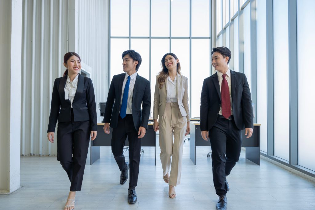 four master degree students walking
